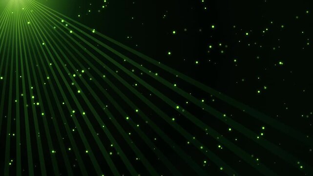 Green light rays with floating dust particles on dark background digital motion graphic clip.