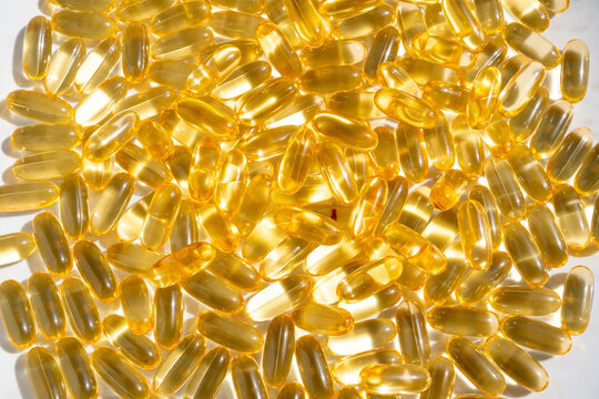 Omega 3 yellow gel capsules, vitamin d bg