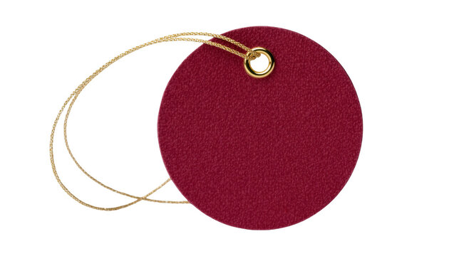 Round crimson textured tag with gold grommet and thin gold string, isolated on transparent background