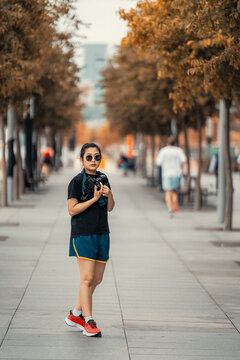 Asian Woman in Sportswear Taking Photos with a Camera in Barangaroo, Sydney, Australia 2 jan 2025
