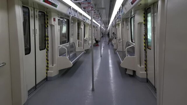 Modern Subway Train Carriage Interior with Empty Seats and Handrails