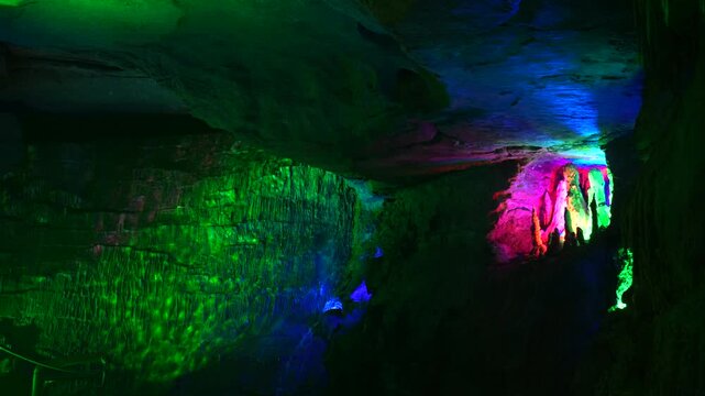Colorful Illuminated Limestone Cave Interior with Vibrant Lights