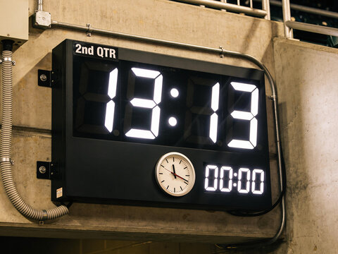 Photorealistic Halftime Stadium Scoreboard Displaying a Fictional 13&ndash;13 Tie