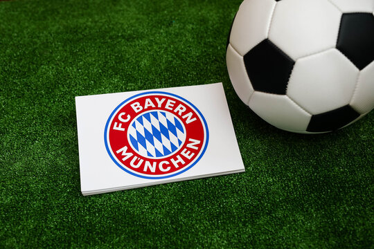A football on the grass and the Bayern Munich Football Club logo. September 30, 2026.