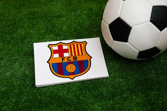 A football on the grass and the Barcelona Football Club logo. September 30, 2026.