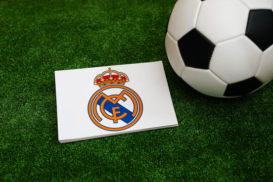 A football on the grass and the Real Madrid Football Club logo. September 30, 2026.