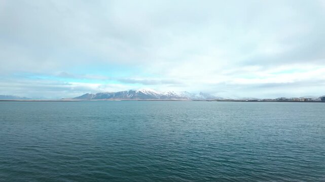 A stunning view of Mt Esja in Reykjav&iacute;k, Iceland with the surrounding calm waters of the Bay.