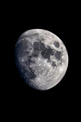 Fototapeta premium Detailed close-up photograph of the moon showcasing complex crater formations and maria against a stark black background.