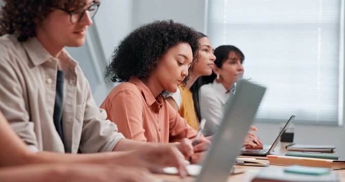 Listening, college and students with notes, laptop and lecture for exam prep in classroom. University, group and people with books, tech and computer for education, learning or lesson for assignment