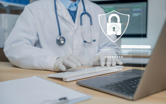 Medical professional is using a laptop in a medical data workspace, accompanied by a digital security padlock icon that symbolizes patient data protection, cybersecurity in healthcare and secure medic