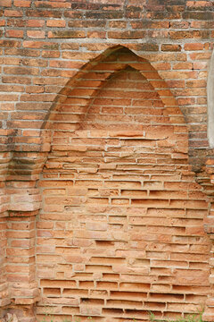 Weathered Red Brick Wall with Pointed Arch Niche