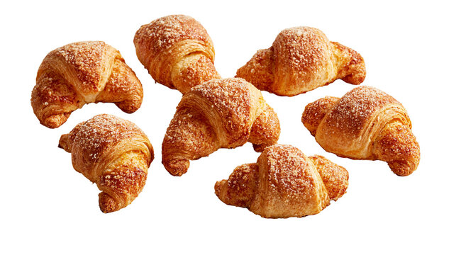Golden brown flaky buttery croissants with sugar topping