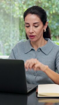Laptop, thinking or woman in company, reading guest list or planning for event management review. Computer, mature person or coordinator in workplace for problem solving, venue budget or typing email