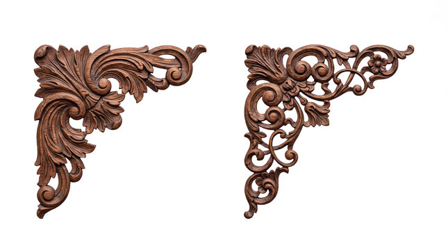 Ornate wood carved corner ornaments with floral scrollwork and acanthus leaf architectural details isolated on black background for furniture design and decorative trim.