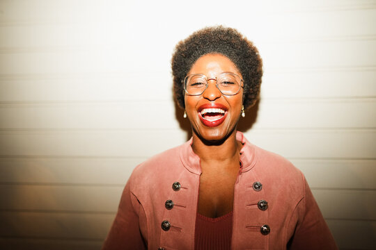 Happy african woman having fun at night time taking photos - Party, nightlife and people lifestyle concept - UGC flash content - Main focus on face