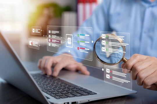 AI email security concept with a professional holding a magnifying glass over a virtual interface that analyzes, filters and separates safe messages from suspicious emails.