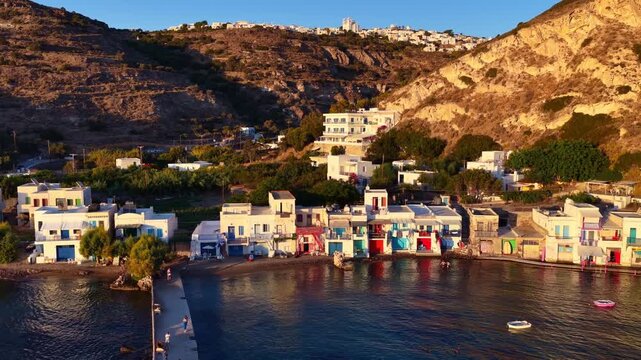 aerial view of Klima village on Milos island, Cyclades, Greece, sunset on Milos, drone view of coast of Greek island of Milos, vacation and tourism in Greece