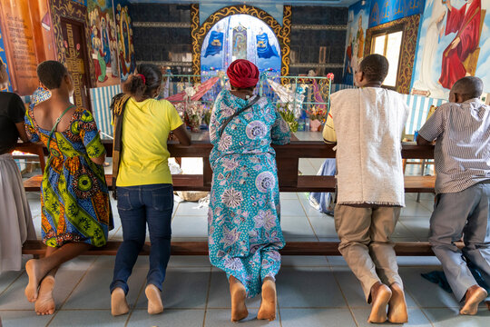 Worshippers praying at a church altar, Togoville, Togo