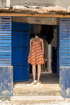Mannequin in a patterned dress at a shop door, Lome, Togo