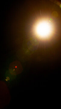Sun flare on the black background