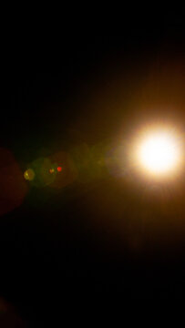 Sun flare on the black background