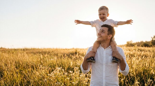 Father Carrying Toddler on Shoulders in Meadow at Sunset