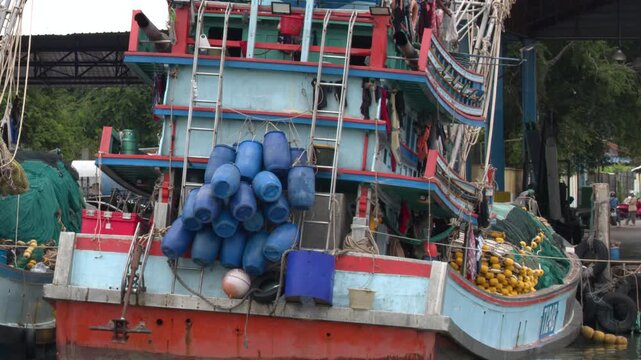 Traditional Colorful Wooden Fishing Trawler Moored at Harbor Pier