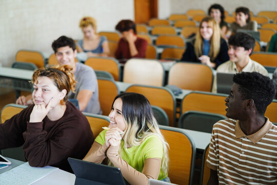 Students inside university class room - Back to school and campus lifestyle concept - Main focus on african male face - UGC content