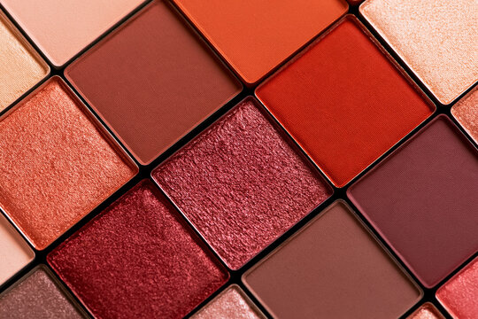 Eyeshadow palette featuring a close up of individual pans with different textures and colors, including matte, shimmer, and metallic finishes