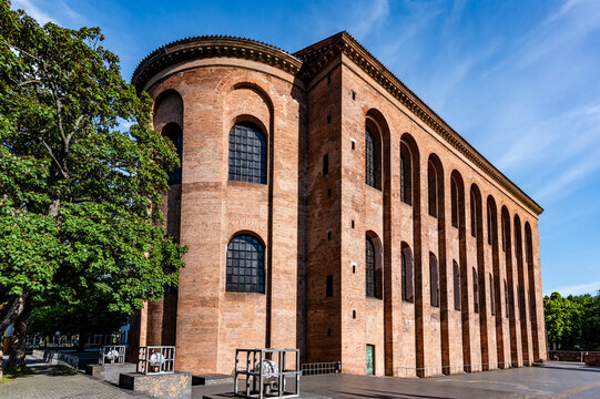 The ancient Basilica of Constantine stands in Trier under a blue sky