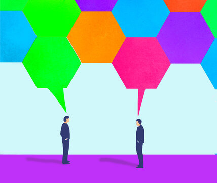 Businessman in conversation with colorful hexagonal speech bubble