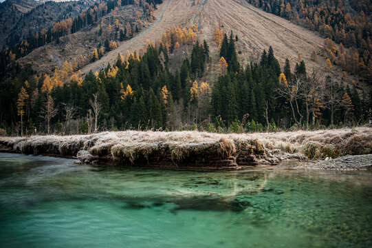The green brook Longa flows through the autumn valley Wei�priach