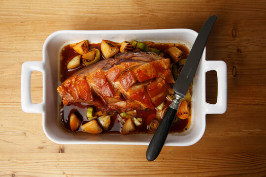 Roast Pork with Crackling in roasting tin, elevated view