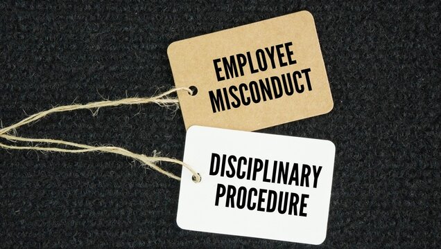 Paper tag with the words employee misconduct and disciplinary procedure. unacceptable or inappropriate behavior