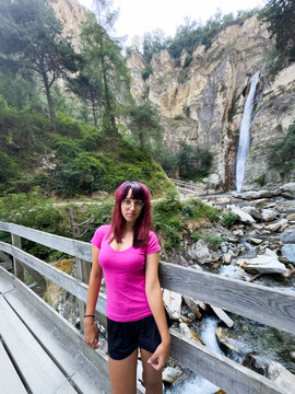 Girl in front of waterfall, Ergisch, Wasserfall Turtmann, Switzerland