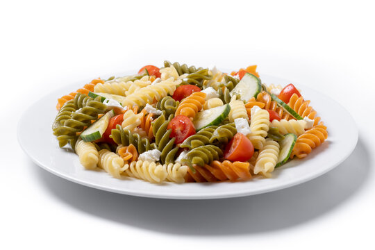 Colorful tricolor pasta salad isolated on white background