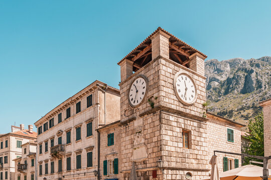 The historic clock tower stands in the old town of Kotor
