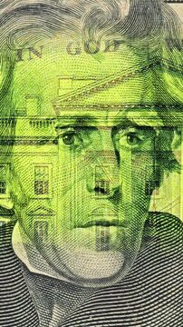 Green Light Moves Across Andrew Jackson Currency Portrait. Andrew Jacksons U.S. dollar portrait glows as green light travels downward. 
