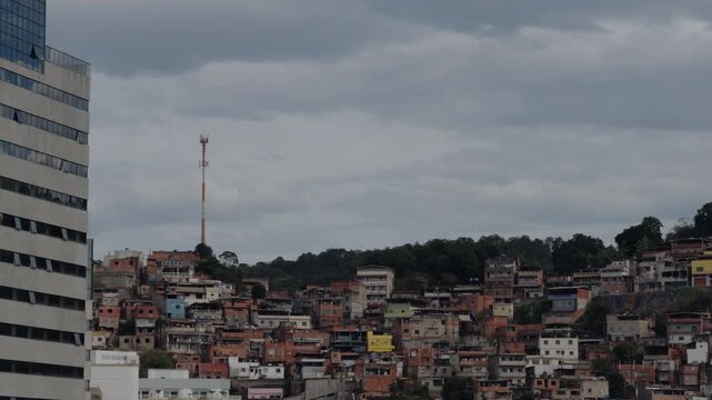 Modern Residential Tower Over Dense Hillside Favela Neighborhood