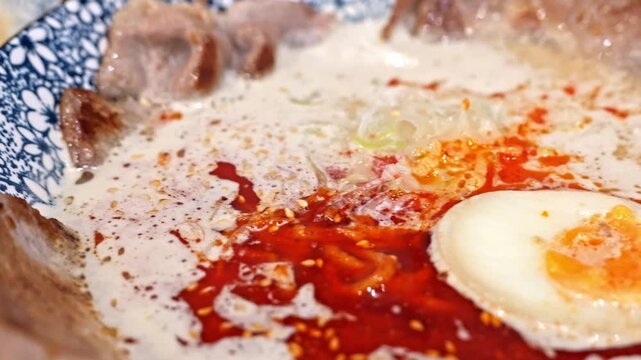 Creamy Noodle Soup with Chili Oil, Fried Egg, Grilled Meat, Rice and Sauce