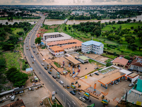 Aerial view of a busy road with a gas station and surrounding buildings in the city of Kaduna, Kaduna, Nigeria.