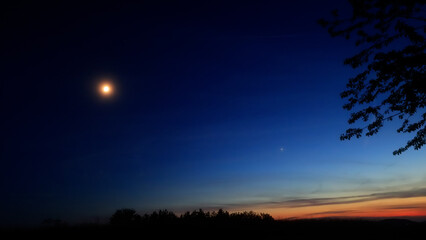Moon, planet conjunction and landscape scenery silhouettes. © astrosystem