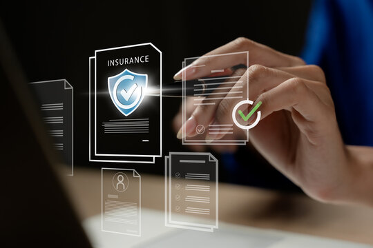 
Businessman reviewing digital insurance policies and compliance documents on a laptop and tablet. Concept of risk management, data security, insurance protection, regulatory compliance, and insurance