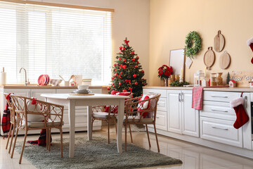 Fototapeta premium Christmas home interior, festive kitchen decoration with decorated tree and holiday spirit for family celebration and winter seasonal home comfort