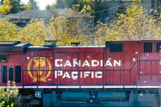 Calgary, AB, Canada. Oct 2, 2026. Side view of a Canadian Pacific locomotive train engine with branding text outdoors on a sunny day.