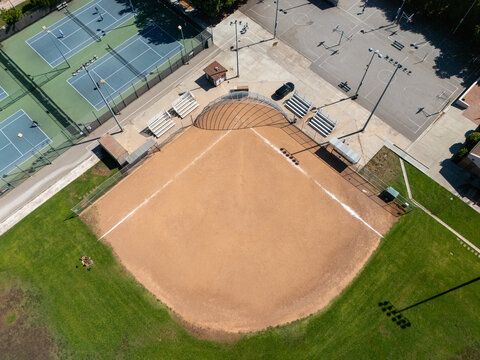 Aerial view of Poinsettia Recreation Center featuring a baseball diamond, tennis courts, and basketball courts in Los Angeles, California, United States.