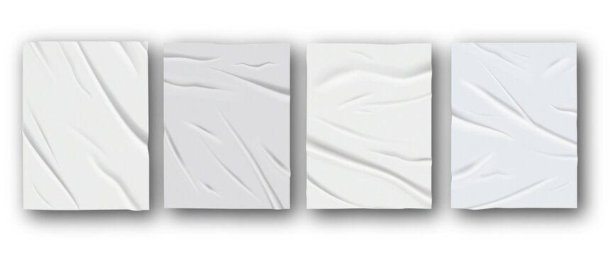 Set of pale adhesive labels in round and oblong shapes with creased surfaces and lifted edges, arranged in two rows on a white backdrop