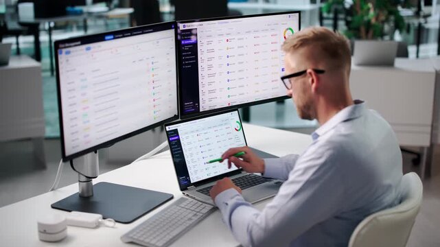Risk Manager Reviews Compliance Dashboard On Laptop