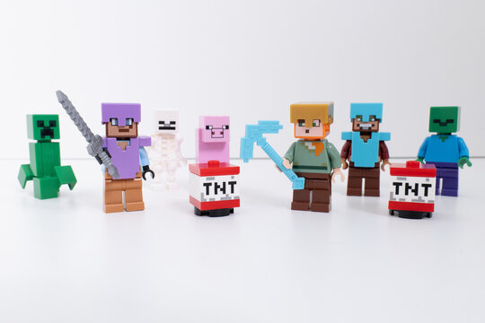 Lego Minecraft mini-figures and TNT blocks shot isolated on a white background. inclides - Steve, Creeper, Pig, & Skeleton. Bradford, UK Oct 2 2026