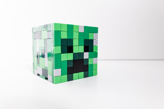 A green Lego Minecraft creeper head shot isolated on a white background. Bradford, UK Oct 2 2026